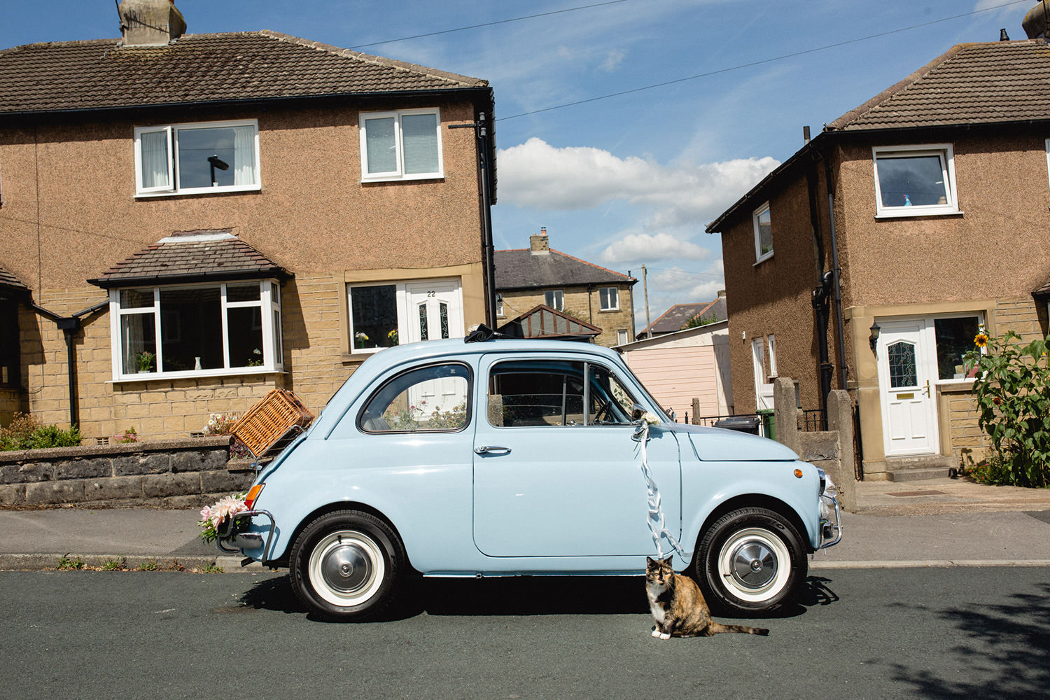 Fun and quirky wedding photography of vintage fiat 500 holmfirth