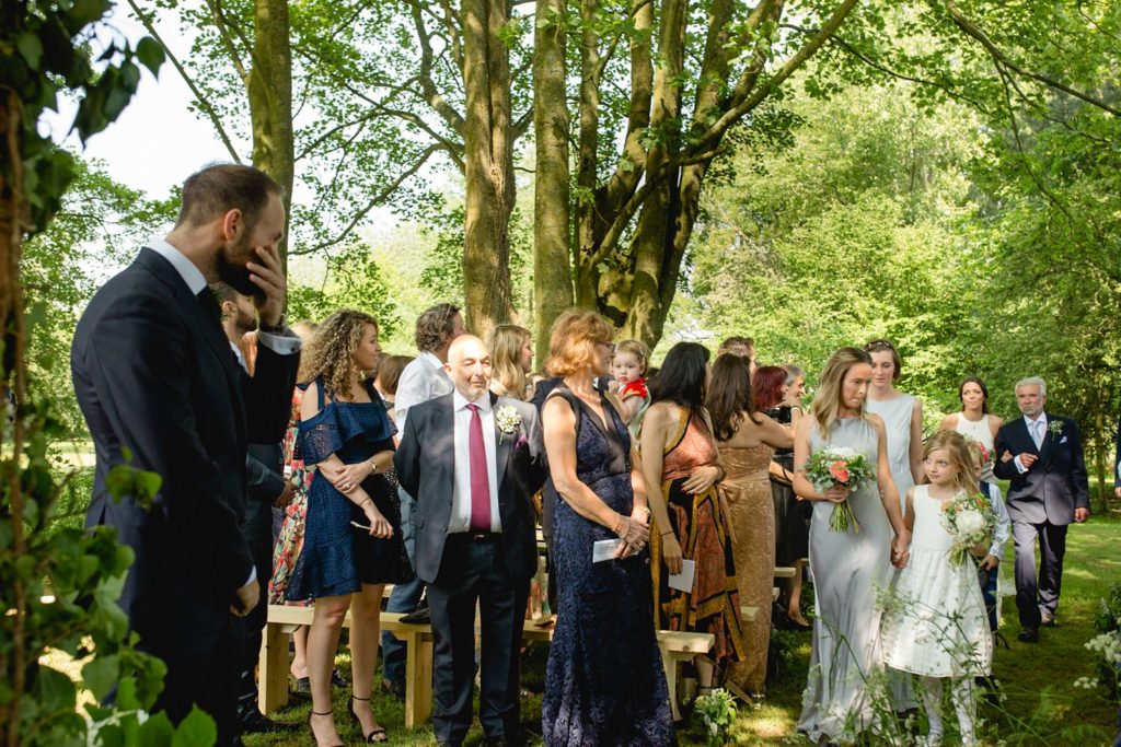 Groom seeing his bride for the first time at outdoor garden wedding kent